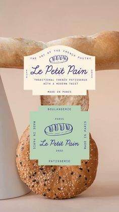 a loaf of bread sitting on top of a white counter next to a sign that says le petit pain