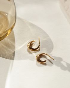 Inspired by the harmonious movement of water, these hoops fuse a sculptural silhouette with a natural ease—our dynamic take on the traditional shape. Sold as a pair. Pair with our larger Flow Hoops for an extra splash of drama (mixing metals encouraged!). Note: these earring posts are slightly thicker than our standard size and might fit a bit snug in your piercing. Modern Crescent Hoop Earrings For Everyday, Modern Crescent Brass Hoop Earrings, Modern Polished Brass Hoop Earrings, Modern Teardrop Hand Forged Hoop Earrings, Modern Hand Forged Hoop Earrings, Modern Small Hoop Earrings Hand Forged, Mixing Metals, Earring Posts, Making Waves