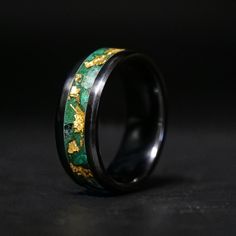 The Royal Emerald Glowstone Ring combines two luxurious colors, green and gold, to create a ring with both elegance and luster. It is housed in a durable and scratch-resistant Black Ceramic band. ■ Ring Details - Metal Type: Black Ceramic - Width: 6mm, 8mm - Inlay Materials: Emerald, Malachite, 24K Gold Leaf - Band: Comfort Fit ■ Resizing: If your ring doesn't fit perfectly, we will be more than happy to exchange it for the right size. ■ Delivery: All our rings are handmade for each order in Ame Green And Black Rings, Men’s Emerald Engagement Rings, Green Fusion Rings For Formal Occasions, Green Enamel Ring With Polished Finish As Gift, Wing Wing, Man Rings, Luxurious Colors, Black Wedding Band, Black Wedding Rings