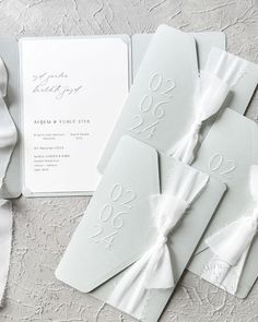 the wedding stationery is laid out and ready for guests to arrive