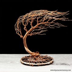 a tree sculpture sitting on top of a table