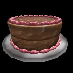 a chocolate cake with pink icing on a plate