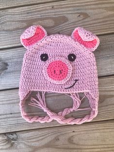 a crocheted hat with a pig face on it