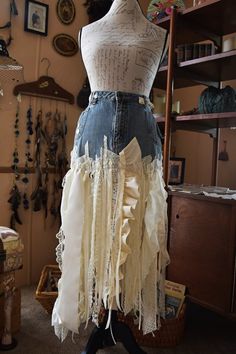 a mannequin is adorned with fabric and lace