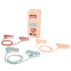 three pairs of hair clips in a pink box with pastel blue handles and straps