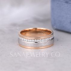 two wedding bands with diamonds on them