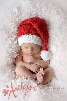 a newborn baby wearing a santa hat