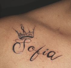 a man with a crown tattoo on his chest that says fjaa in cursive writing