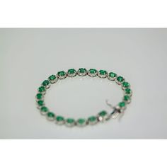 This is part of Chairish’s Fine Jewelry assortment.  Emerald Diamond Platinum link Bracelet  If you love Emeralds as I do you will love this bracelet. This gorgeous bracelet is done in perfectly matched Emeralds with a Diamond surround. The bracelet is 7" long, width is 5mm and weights 22.6 grams. The Emeralds are natural oval brilliant crown cut there are twenty three measuring 5x4 and totaling 6.55 carats, good to very good. Each Emerald is 0.40 carats each. The brilliant cut natural Diamonds Elegant Green Sterling Silver Jubilee Bracelet, Elegant Green Round Chain Bracelet, Gorgeous Bracelet, Emerald Diamond, If You Love, Link Bracelets, Natural Diamonds, Love This, Platinum