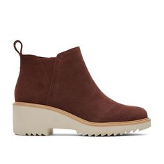 PRICES MAY VARY. Mid wedge bootie with suede uppers and asymmetric toe detail Features removable insole, heel pull tab, side zip, and lateral V gore for easy on and off OrthoLite Eco LT Hybrid insoles made with 26% eco content (15% waste foam, 5% recycled content and 6% bio-oils) EVA wedge outsole with TPR welt Wedge height is approximately 2" and shaft height is approximately 3 1/2" Toms Mallow Boots, Women's Fall Shoes, Autumn Shoes Women, Bio Oil, Mental Health Resources, Leather Products, Recycled Rubber, Suede Wedges, Fall Shoes