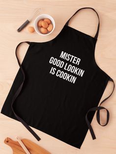 an apron that says morons your bus is leaving next to eggs and utensils