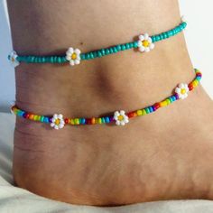 Dainty daisy anklet/ summer anklet/dainty anklet/ rainbow anklet/ rainbow anklet/ trendy jewellery/ cute boho jewellery/ dainty jewelry. Very fragile but beautiful as long as you're careful! Perfect gift for family or friends, or just something for yourself! To measure your anklet size, I suggest taking a piece of string (or a tape measure if you have one) and then measure around your ankle and choose the closest (or slightly larger) option!  If there are any problems please let me know on here or on my Instagram: @lanneaux_jewellery! Adjustable Dainty Anklets With Colorful Beads, Dainty Adjustable Anklets With Colorful Beads, Spring Anklets With Colorful Beads, Handmade Dainty Adjustable Anklets, Handmade Adjustable Dainty Anklets, Dainty Handmade Adjustable Anklets, Dainty Colorful Beads Anklets As A Gift, Colorful Beaded Anklets For Spring Gift, Dainty Anklets With Colorful Beads As Gift