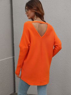 Our Clia Knit comes in a neon orange colour in an oversized drape fit. This features a heart neckline and open V back collar, batwing long fitted sleeves, and a roomy fit making this ideal for growing baby bumps. This piece is made from lightweight breathable material which is perfect for a trans-seasonal outfit. Pair with jeans for a lazy day outfit or complete the look with our Jady Rose Heels. Size Guide: Ambre is 5’2” tall, and has a 33.2” bust, 24.5”waist, & 36.7” hips. She is wearing a S / Orange V-neck Knit Top, Orange V-neck Knit Sweater, Orange Knit V-neck Top, Orange Stretch Long Sleeve Sweater, Orange Long Sleeve Stretch Sweater, Orange Long Sleeve Soft Knit Sweater, Orange Soft Knit Long Sleeve Sweater, Trendy Orange V-neck Sweater, Orange V-neck Sweater For Fall