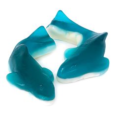 three pieces of blue and white candy sitting on top of each other