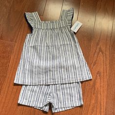 Cute 2 Piece Set For Toddler. Pull On Shorts And Ruffle Sleeveless Top. Linen Material. Blue Cotton Playdate Sets, Cotton Tops Matching Set For Playtime, White Matching Set Tops For Playwear, Blue Summer Tops For Playtime, Casual Spring Sets For Playdate, Casual Spring Playdate Sets, Fitted Casual Sets For Playdate, Bodysuit And Shorts, Chiefs Shirts