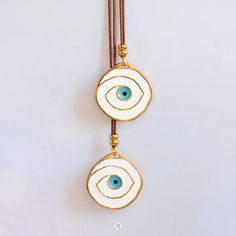 *Big metallic evil eye necklace in white & blue colors *Brown cord *No clasp - Adjustable length *You can combine it with this bracelet: https://www.etsy.com/listing/387433718/evil-eye-bracelet-evil-eye-jewelry-greek?ref=shop_home_active_40 **If you need more information, feel free to contact me! Thank you! Facebook: christel boutique Twitter: @christel_btq Instagram: @christel_boutique White Bohemian Necklace With Evil Eye, Bohemian White Necklace With Evil Eye Detail, Bohemian White Evil Eye Necklace, White Evil Eye Round Pendant Necklace, White Round Pendant Necklace With Evil Eye, Necklace Evil Eye, Greek Evil Eye, Greek Jewelry, Protection Bracelet