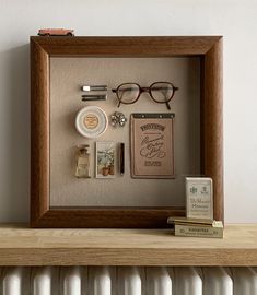 Framed piece filled with items a secretary would have carried in her handbag, all in hues of pink, brown and white. Memrobilia Display Ideas, Gallery Wall With Shadow Boxes, Displaying Small Collectables, Pin Shadow Box Display, Framed Objects Wall Art, Bathroom Shadow Box Ideas, Shadow Frames Ideas, Sentimental Gallery Wall, Memory Box Frame Ideas