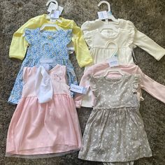 Nwt ! Four Carters Sets. Three Dresses With Matching Cardigan. One Dress With Matching Headband. All 6 Months White Dress-up Sets For Spring, Cute White Dress-up Sets, White Long Sleeve Dress For Playwear, Spring Dress-up Sets In White, White Cotton Dress-up Set, White Long Sleeve Dress-up Sets, White Long Sleeve Playwear Dresses, Dinosaur Outfit, Carters Baby Girl Clothes