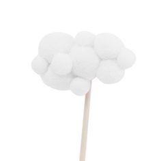 a white cotton candy on a stick with some sort of pom - pom