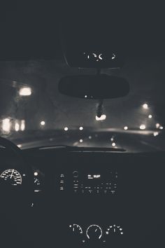 the dashboard of a car at night time