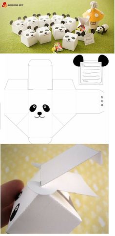 an origami panda bear is in the process of being cut out and put into a box