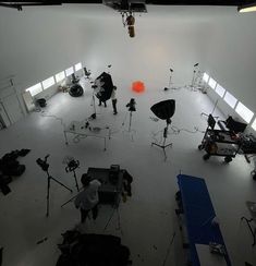 an overhead shot of a photographer's studio with lights and equipment in the foreground