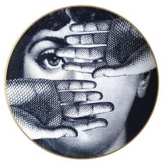 a plate with an image of a woman covering her face and hands over her eyes