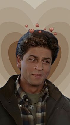 a man is looking at the camera with hearts above his head