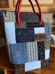 a purse sitting on top of a wooden table