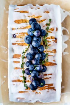 a cake with blueberries and icing on it