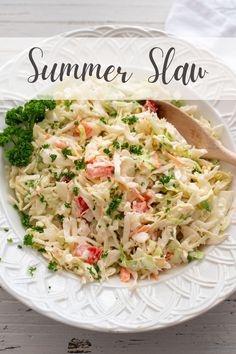 a white bowl filled with coleslaw salad on top of a wooden table