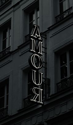 a black and white photo of the marquee for amouir in paris