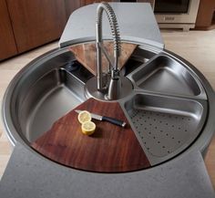 a kitchen sink with a cutting board on it