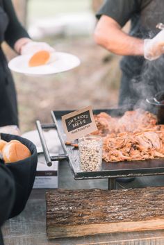 some people are cooking food on a grill