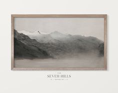 a black and white photo with mountains in the background that reads sever hills on it