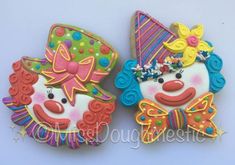 two decorated cookies with clown faces on them