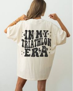 Cute triathlon tshirt women T-shirt triathlete retro women triathlon shirt iron woman triathlete female t shirt female triathlete for women CUSTOM DESIGN REQUESTS ARE WELCOME! MESSAGE ME 😊 𝑯𝑶𝑾 𝑻𝑶 𝑶𝑹𝑫𝑬𝑹 ✅ Choose color option ✅ Read size chart and select size ✅ Add to cart ✅ Check out and purchase item ✅ Shipping info provided via Etsy 𝑰𝑻𝑬𝑴 𝑰𝑵𝑭𝑶 😊 Comfort Colors 1717 T-Shirts 😊 Unisex Adult Sizing 😊 Direct to garment printing 😊 See listing for colors 😊 See listing for size chart 𝐘𝐨𝐮 𝐦𝐚𝐲 𝐚𝐥𝐬𝐨 𝐥𝐨𝐯𝐞... Custom Medal Holder https://www.etsy.com/listing/1657749048/personalized-medal-hanger-triathlon?click_key=5e0d038c27b408be6fcad0d0a1672b90d2e64812%3A1657749048&click_sum=62f35ded&ref=shop_home_feat_1 Customizable Transistion Towel! https://www.etsy.com/listin Moisture-wicking T-shirt For Summer, Summer Workout T-shirt With Screen Print, Female Triathlete, Women Triathlon, Triathlon Shirts, Message To, Triathlon Women, Female T Shirt, Iron Woman