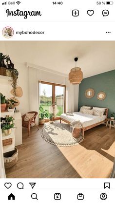 an instagram photo of a bedroom with green walls and wood flooring in the room