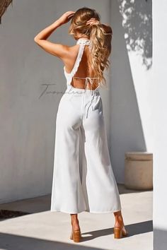 FREE 2-3 DAY SHIPPING USA WIDE. The Bree Jumpsuit in White is stunning. It has a high neckline with an open back and is fully lined to cover undergarment. Please note that the pants of the colored jumpsuits (Mauve & Steel Blue) do not have lining. It has a center back zipper. *Model is 5'7" and wears a size 4/SMALL *Model measurement - Bust: 84cm Elegant Spring Jumpsuits And Rompers With Back Opening, Spring Backless Bottoms With Tie Back, Chic Backless Bottoms For Spring, Chic Backless Spring Bottoms, High Neck Jumpsuits And Rompers For Summer, Chic Summer Jumpsuits And Rompers With Back Zipper, Chic Backless Jumpsuits And Rompers With Back Opening, Spring Backless Jumpsuit With Back Opening, Chic Backless Jumpsuit With Back Opening