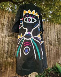 Long black 90s style trench coat ||  Polyester material ||  Lightweight/ comfortable / pockets  Size Small/Medium  Petite arm sleeves ||  Size 13/14 on tag 🖤 Hand painted and sealed design ||  Hand wash only || spot clean Hand Painted Trench Coat, Artistic Black Long Sleeve Outerwear, Artistic Black Outerwear For Fall, Hand Painted Jacket, Trench Noir, Style Trench Coat, Black 90s, Jacket Outdoor, Painted Jacket