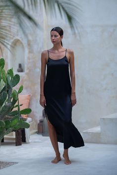 Teuta Maxi Silk Slip Dress ﻿is the latest addition to our LUXURY SILK BASICS This items is named after Teuta (Illyrian: *Teutana, 'mistress of the people, queen') was the queen regent of the Ardiaei tribe in Illyria, who reigned approximately from 231 BC to 228/227 BC. The Ardiaei were once of the most powerful and influential tribes in Illyria, and Teuta’s real power and prowess lay in her ability to strategically partner with allies and conduct negotiations. In one famous story, a Roman delega Luxury Silk Slip Dress With Side Slits, Summer Night Maxi Length Dress, Summer Night Maxi Dress, Black Silk Dresses With Side Slits, Silk Bias-cut Slip Dress For Loungewear, Black V-neck Slip Dress With Satin Finish, Black Silk V-neck Maxi Dress, Black Silk Bias-cut Dress, Women Leaders