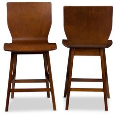 two wooden stools sitting next to each other