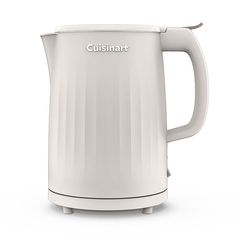 a white electric kettle sitting on top of a table