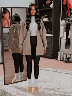 a woman standing in front of a mirror wearing black leggings and a white shirt