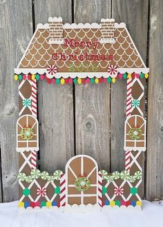 a gingerbread house is decorated with candy canes