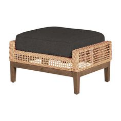 a wicker footstool with a black cushion on the top and bottom part