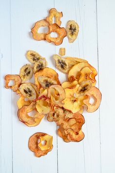 sliced bananas and other fruit on a white surface