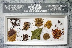 a white tray filled with different types of spices