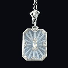 "Submitted for your thoughtful consideration:   1920's Filigree Camphor Crystal Lavalier Diamond 14K.  Both chain and pendant are marked 14K. Classic Great Gatsby Elegance. Etched rock crystal. Great detail. Approx. 3-pt diamond. Weight: 6g Dimensions: 1\" x 5/8\" Condition: Excellent, wear consistent with age Size: 1\" x .75\"  The item has been photographed and described with care, honesty, and integrity.  The item comes from a pet-free/smoke-free environment. *NOTE: California residents will pay sales tax. **At this point in time, we are not accepting returns.  However, for purchases, we will consider a reasonably varying offer. All items over $100 will require your signature for accepting the delivery and will be invoiced with appropriate insurance." Formal Art Nouveau Diamond Jewelry, Antique White Gold Filigree Necklace, Antique White Gold Necklace With Filigree, Antique Diamond Intaglio Jewelry, Art Deco Platinum Necklace With Diamond Cut, Art Deco Diamond Cut Necklace For Anniversary, Art Deco Pendant Necklace For Formal Occasions, Vintage White Gold Diamond-cut Necklace, Antique Diamond Evening Necklaces