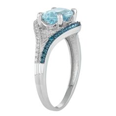 Adorned with a genuine blue topaz center stone accented with blue and white diamonds, this sterling silver ring lends a touch of sparkle to your look.RING DETAILSWidth: 10.9 mmMetal: sterling silverPlating: rhodiumFinish: polishedPackaging: boxedSTONE DETAILSStone type: blue topazTotal weight: 2 1/5 ct.Center stone size: 9 mm x 7 mmShape: ovalSetting: prongDIAMOND DETAILSTotal weight: less than 1/10 ct.Shape: roundColor grade: H-IClarity: I2-I3Setting: prongGemstones may have been treated to enh Diamond Accent Ring, Right Hand Rings, Ring Blue, White Diamonds, Silver Blue, Diamond White, Sterling Silver Ring, Blue Topaz, Silver Ring